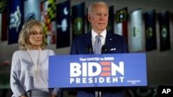 Democratic presidential candidate former Vice President Joe Biden, accompanied by his wife Jill, speaks to members of the press at the National Constitution Center in Philadelphia, March 10, 2020. (AP Photo/Matt Rourke)