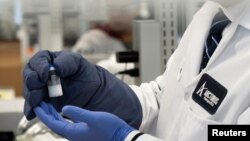 A frozen sample of an RNA vaccine for the novel coronavirus (COVID-19) is displayed by Arcturus Therapeutics CEO Joe Payne at one of the company's laboratories in San Diego, California, March 17, 2020.