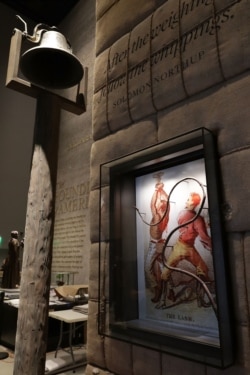 FILE - A whip used to punish slaves is on display in the Slavery and Freedom Gallery in the Smithsonian's National Museum of African American History and Culture, Sept. 14, 2016, in Washington.