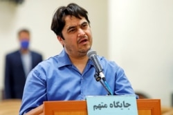 FILE - Ruhollah Zam, a dissident journalist who was captured in what Tehran calls an intelligence operation, speaks during his trial in Tehran, Iran, June 2, 2020. (Mizan News Agency/WANA)