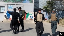 Afghan police arrive at the site of an attack at Kabul University in Kabul, Afghanistan, Nov. 2, 2020.