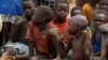 FILE - Orphans and children separated from their parents in Kadugli gather for food at an internally displaced persons camp in Boram County, Nuba Mountains, South Kordofan, Sudan, June 22, 2024.