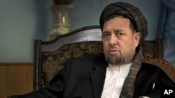 FILE - Deputy Afghan Chief Executive Mohammed Mohaqiq in his office in Kabul, Afghanistan, Oct. 27, 2013. 