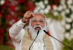 FILE PHOTO: India's Prime Minister Narendra Modi addresses a gathering in Ahmedabad, India, March 12, 2021.
