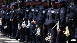 Police officers stand in front of the entrance of Columbia University in New York on April 22, 2024.