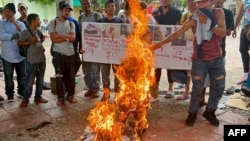 A group of migrant people take part in a demonstration against the summit on migration held in Tapachula, Chiapas state, Mexico on Oct. 22, 2023.