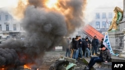 FILE - A farmer protest action in the European district in Brussels, organized by general farmers union ABS (Algemeen Boerensyndicaat) to demand better conditions to grow, produce and maintain a proper income, on the day of a European Council meeting on Feb. 1, 2024. 