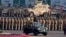 FILE - Pakistan's President Mamnoon Hussain, center on a military vehicle, reviews a military parade to mark Pakistan's Republic Day, in Islamabad, Pakistan, March 23, 2017. 