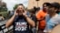 FILE - A man who called himself a citizen taxpayer, left, argues with protesters at a a rally to oppose a new Texas "sanctuary cities" bill that aligns with the president's tougher stance on illegal immigration, June 26, 2017, in San Antonio, outside of t
