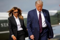 U.S. President Donald Trump and first lady Melania Trump board Air Force One as they depart Washington on campaign travel to participate in the first presidential debate with Democratic presidential nominee Joe Biden in Cleveland, Ohio.