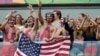 USA fans celebrate after team USA qualifying for the next World Cup round following their 1-0 loss to Germany during the group G World Cup soccer match between the USA and Germany at the Arena Pernambuco in Recife, Brazil, Thursday, June 26, 2014.