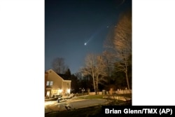 This photo provided by Brian Glenn shows what appears to be multiple drones flying over Bernardsville, New Jersey, Dec. 5, 2024.