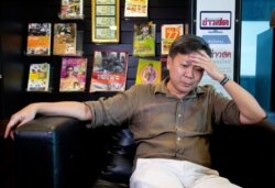 FILE - Thai journalist Pravit Rojanaphruk gestures during an interview with the Associated Press, in Bangkok, Thailand, May 10, 2016.