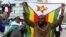 Protesters gather calling for Zimbabwean President Robert Mugabe to step down, in Harare, Zimbabwe, Nov. 18, 2017.