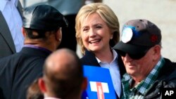 Democratic presidential candidate Hillary Rodham Clinton speaks with members of the audience, Oct. 7, 2015, during a campaign stop at the Westfair Amphitheater in Council Bluffs, Iowa.