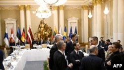 The leaders of Lithuania, Latvia, Sweden, Finland, Germany and Denmark chat with NATO Secretary General Mark Rutte during a summit of the Baltic Sea NATO countries at the Presidential Palace in Helsinki, Finland, on Jan. 14, 2025.