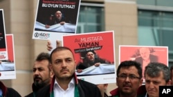 Turkish lawyers hold a protest outside Istanbul's court, July 17, 2017, demanding the release of Mustafa Yaman, a lawyer who according to Turkish media was detained earlier this month. 