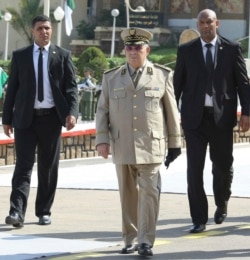 FILE - Algerian chief of staff Gen. Ahmed Gaid Salah arrives to preside over a military parade in Algiers, July 1, 2018.