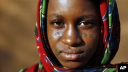 A young Fulani woman with traditional facial tattoos is seen in Niamey, Niger. Voters in Niger go to the polls this month in a referendum on changing the constitution, (File).