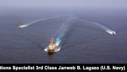 The guided-missile destroyer USS Mason (DDG 87) conducts formation exercises with the Cyclone-class patrol crafts USS Tempest (PC 2) and USS Squall (PC 7) in the Arabian Sea, Sept. 10, 2016.