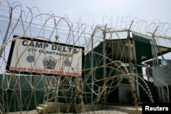 FILE - The front gate of Camp Delta is shown at the Guantanamo Bay Naval Station in Guantanamo Bay, Cuba.