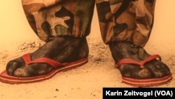 A White Army soldier in South Sudan who fights in flip-flops.The image is part of US photographer Tim Freccia's "Life and Death" series on South Sudan