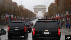The motorcade of President Donald Trump drives up the Champs Elysees to an Armistice Day Centennial Commemoration at the Arc de Triomphe, Nov. 11, 2018, in Paris.