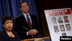 U.S. Attorney General Loretta Lynch and FBI Director James Comey hold a news conference to announce indictments on Iranian hackers for a coordinated campaign of cyber attacks on several U.S. banks and a New York dam, at the Justice Department in Washingto