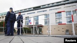 Police officers secure the French Embassy in Berlin a day after the Paris attacks, Nov. 14, 2015.