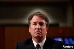 FILE - U.S. Supreme Court nominee Judge Brett Kavanaugh listens during his U.S. Senate Judiciary Committee confirmation hearing on Capitol Hill in Washington, Sept. 4, 2018.