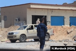 Soldiers with the U.N.-recognized Government of National Accord exchange fire with Khalifa Haftar's Libyan National Army in the suburbs of Tripoli, Libya, April 28, 2019.
