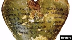 A heart-shaped lead urn with an inscription identifying the contents as the heart of Toussaint Perrien, Knight of Brefeillac, found during excavation of the ruins of the medieval Jacobins convent in Rennes.