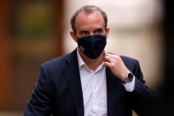 FILE - Britain's Foreign Affairs Secretary Dominic Raab walks outside Downing Street in London, Britain, Feb. 3, 2021.