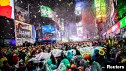 Revelers get ready to welcome the New Year in Times Square, New York, Dec. 31, 2018.