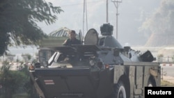 Myanmar's military checkpoint is seen on the way to the congress compound in Naypyitaw, Myanmar, Feb. 1, 2021. 