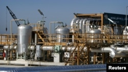 A general view of the Neka oil terminal 300 Kms North east of Tehran April 29, 2004. Under the CROS project inaugurated in the Caspian port of Neka, Iran will take crude oil from Russia, Kazakhstan and Turkmenistan and transfer them through pipelines to r