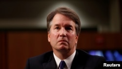FILE - U.S. Supreme Court nominee Judge Brett Kavanaugh listens during his U.S. Senate Judiciary Committee confirmation hearing on Capitol Hill in Washington, Sept. 4, 2018.
