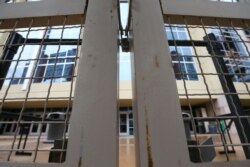 The gates to Gila River Arena, home of the Arizona Coyotes hockey team, are all closed and locked since the Coyotes' scheduled hockey game with the Vancouver Canucks was canceled in Glendale, Ariz., March 12, 2020.