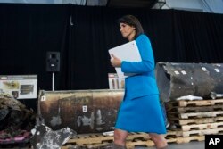FILE - U.S. Ambassador to the U.N. Nikki Haley walks in front of allegedly recovered segments of an Iranian rocket during a press briefing at Joint Base Anacostia-Bolling, Dec. 14, 2017, in Washington.