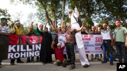 Myanmar ethnic Rohingya Muslims shout slogans during a protest against the persecution of Rohingya Muslims in Myanmar, in Kuala Lumpur, Malaysia, Sunday, Dec. 4, 2016. 