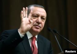 Turkey's President Tayyip Erdogan delivers a speech at the Presidential Palace in Ankara, Jan. 12, 2017.