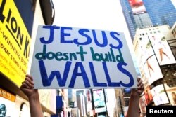 FILE - Interfaith religious leaders protest against Republican U.S. presidential candidate Donald Trump outside a hotel where he was to meet with evangelical leaders in New York City, June 21, 2016.