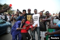 Gambians take to the street to celebrate as Adama Barrow is sworn-in as President of Gambia, Jan. 19, 2017.