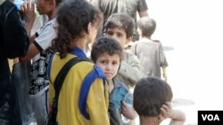 Authorities say children and wives of IS fighters are considered civilians, but other families often shun them. (H.Murdock/VOA)