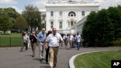 Members of the media, and others, are evacuated from the White House in Washington, June 9, 2015. 