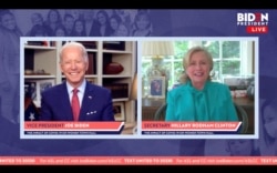 Democratic presidential candidate Joe Biden smiles as former Secretary of State Hillary Clinton endorses him for president in a video screengrab made during an online town hall, in Wilmington, Delaware, April 28, 2020. (Biden For President/Handout)
