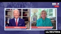 Democratic U.S. presidential candidate Joe Biden smiles as former Secretary of State Hillary Clinton endorses him for president in a video screengrab made during an online town hall, in Wilmington, Delaware, April 28, 2020. (Biden For President/Handout)