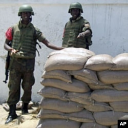 African Union (AU) peacekeepers from Uganda stand guard outside the Somalia presidential palace in the capital Mogadishu, (2009 file photo)
