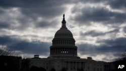 FILE - The Capitol in Washington, is framed by early morning clouds, March 19, 2024. 