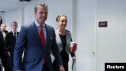 Pete Hegseth, President-elect Donald Trump's choice for defense secretary, visits senators on Capitol Hill in Washington, Dec. 5, 2024.